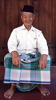 sarong Kudus, Pa Haji Maksum wears a pelicat sarong..jpg